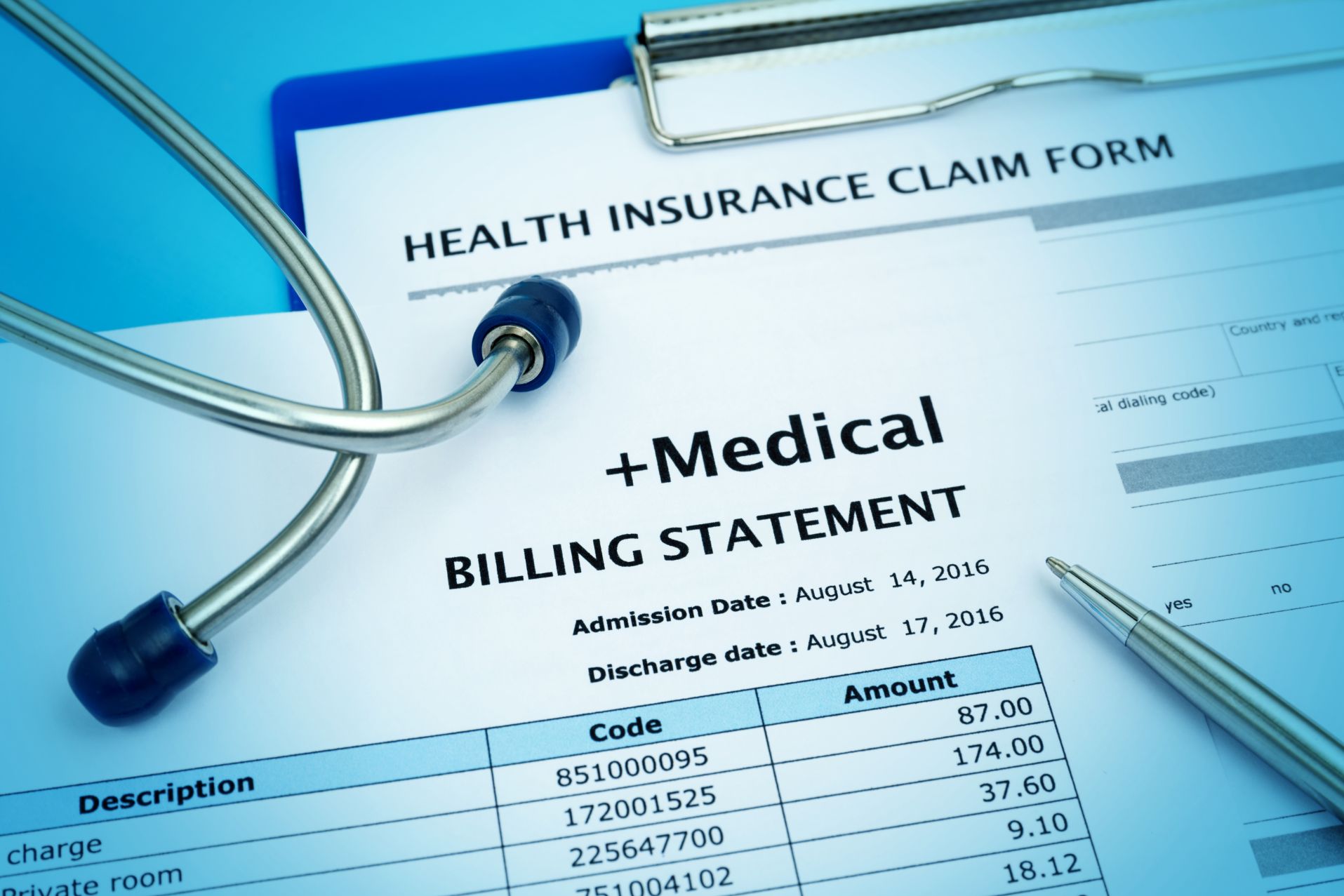 Medical billing statement with a pen and stethoscope